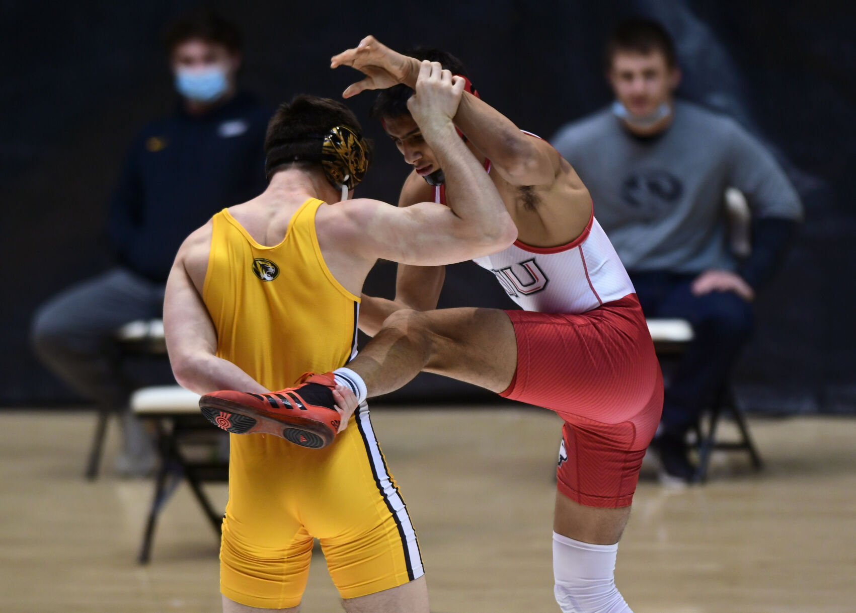 Keegan O'Toole grabs the leg of Izzak Olejnik